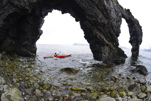 kayaking iceland arch adventure volcanic landscape.jpg